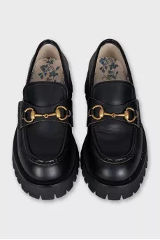 Black leather loafers with gold embroidery