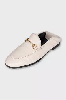 White leather loafers