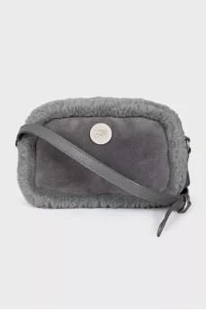 Suede bag decorated with fur