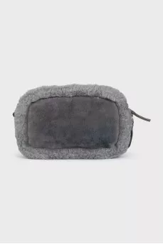 Suede bag decorated with fur