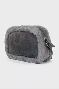 Suede bag decorated with fur