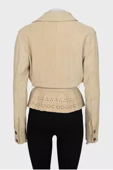 Wrap shirt decorated with perforations