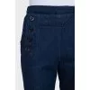 Blue straight jeans decorated with buttons