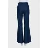 Blue straight jeans decorated with buttons