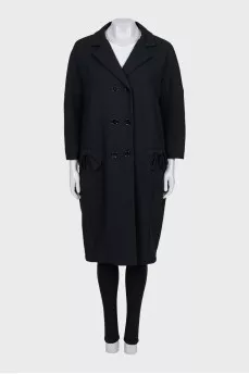 Double-breasted coat with bows