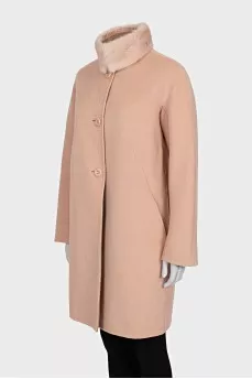 Pink coat with a fur collar