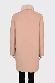 Pink coat with a fur collar