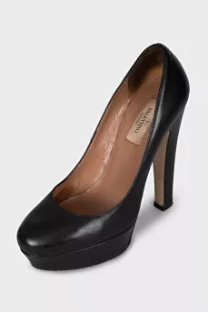Black leather high heel shoes
