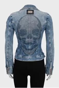 The denim jacket is decorated with rhinestones.