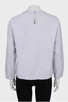 Gray sweatshirt decorated with beads