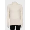 White turtleneck sweater