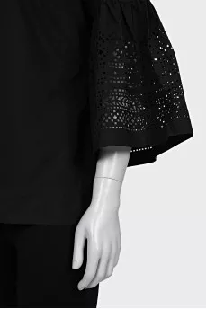 Black blouse with perforated sleeves