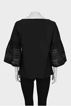 Black blouse with perforated sleeves