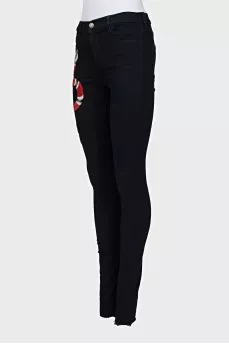 Skinny jeans with snake embroidery