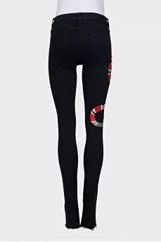 Skinny jeans with snake embroidery