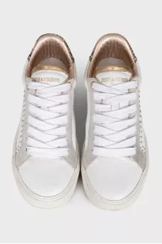 White sneakers with animal print inserts