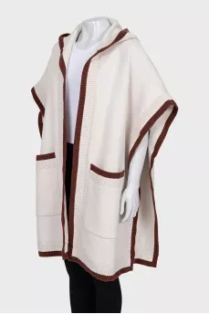 White cape with brand logo