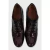 Patent leather lace-up ankle boots