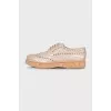 Beige perforated shoes