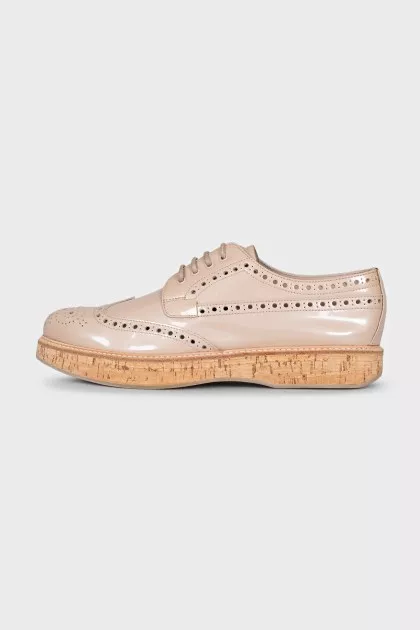 Beige perforated shoes