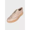 Beige perforated shoes