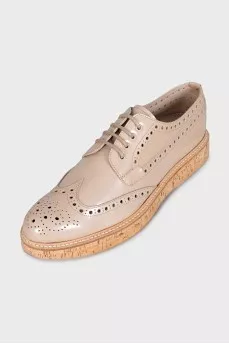 Beige perforated shoes