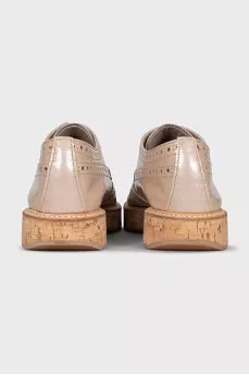 Beige perforated shoes