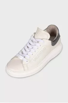 White leather sneakers with brand logo