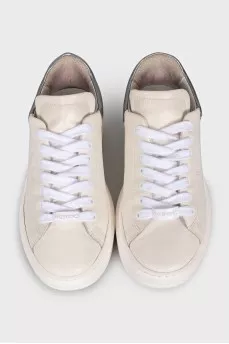 White leather sneakers with brand logo
