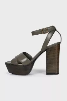 Green sandals with a stable heel