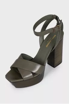 Green sandals with a stable heel