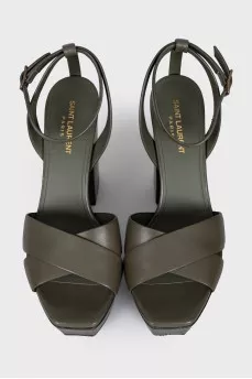 Green sandals with a stable heel