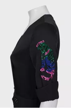 Black jumpsuit with a patch