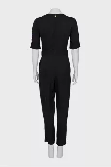 Black jumpsuit with a patch