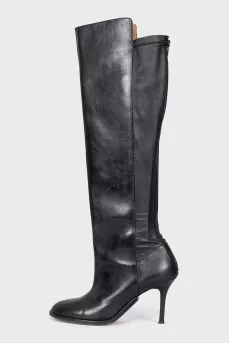 Black leather boots with a zipper