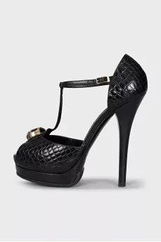 Black leather sandals with gold decor