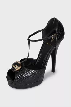 Black leather sandals with gold decor
