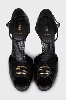Black leather sandals with gold decor