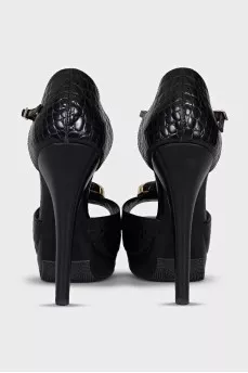 Black leather sandals with gold decor