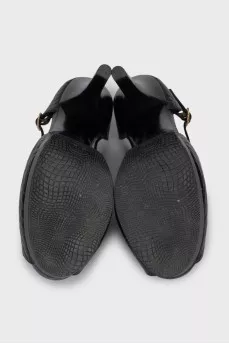 Black leather sandals with gold decor