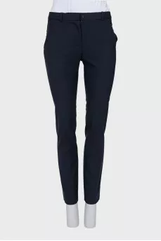 Tapered mid-rise trousers with pockets