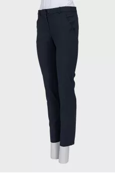 Tapered mid-rise trousers with pockets