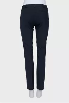 Tapered mid-rise trousers with pockets