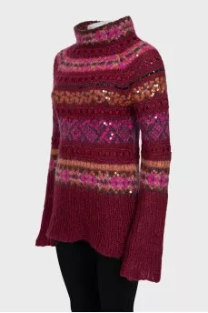 Long sweater decorated with sequins