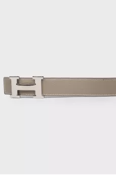 Bilateral belt with a proprietary buckle