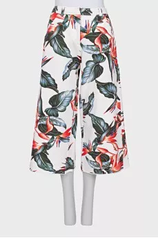 White suit with floral print trousers