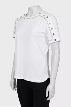 White T-shirt decorated with buttons