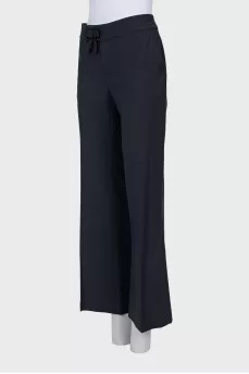 Flared trousers with a bow