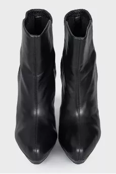 Black ankle boots with a relief pattern