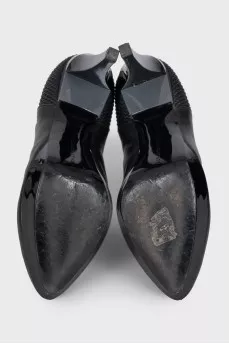 Black ankle boots with a relief pattern